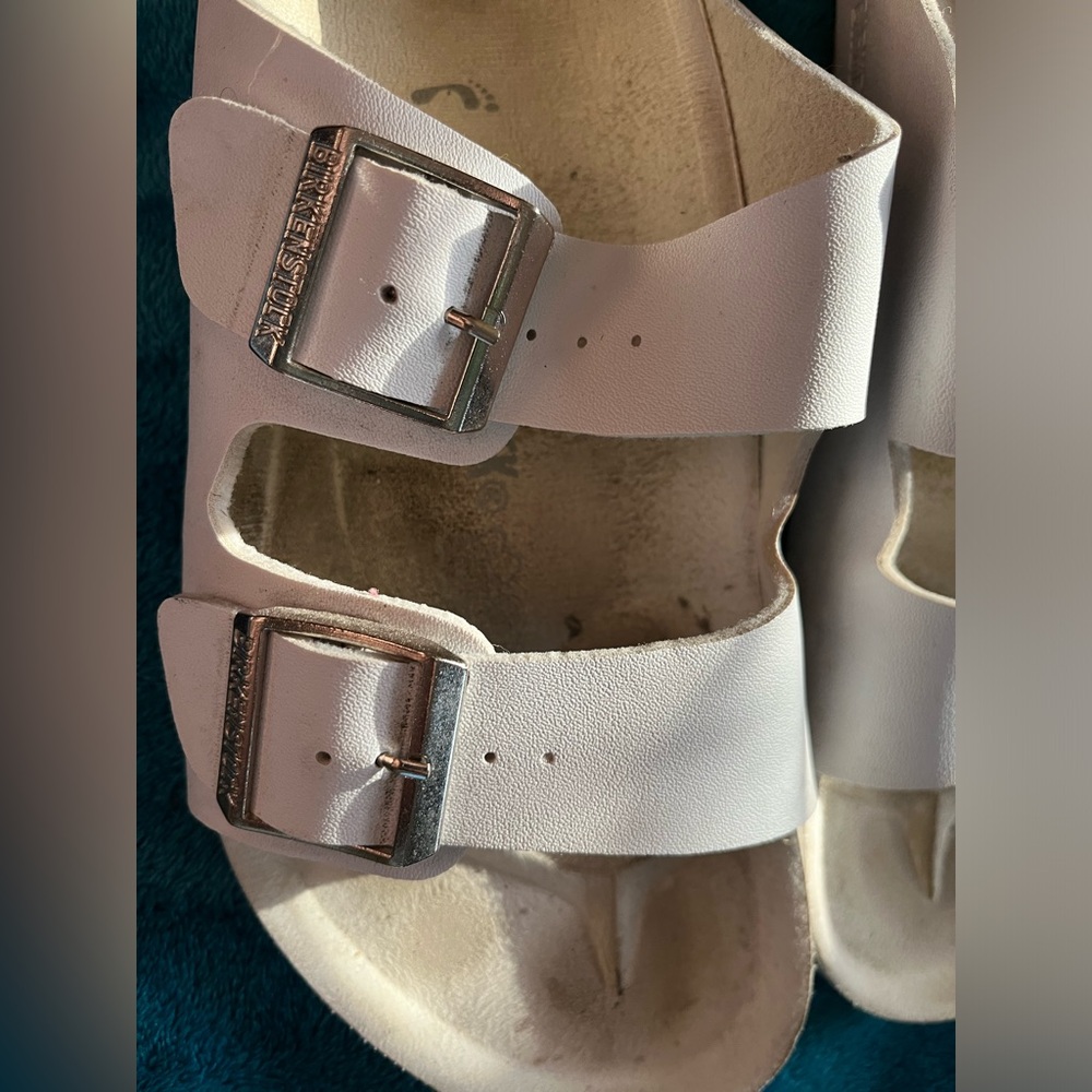 White Birkenstock sandals, size 42 (US men’s 9, womens 11).